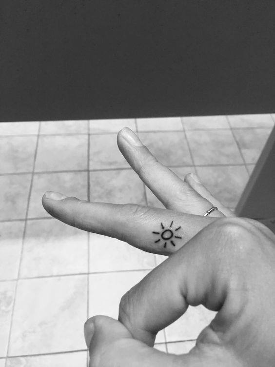 small sun tattoo
