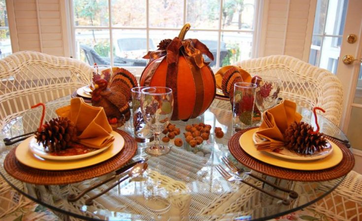 Ribbon Tied Pumpkin With Dried Pine Fruit For Thanksgiving